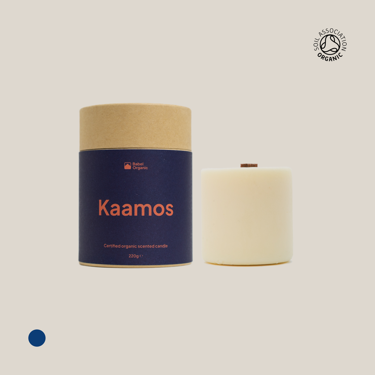 Blue Kaamos candle with candle refill on a beige background.