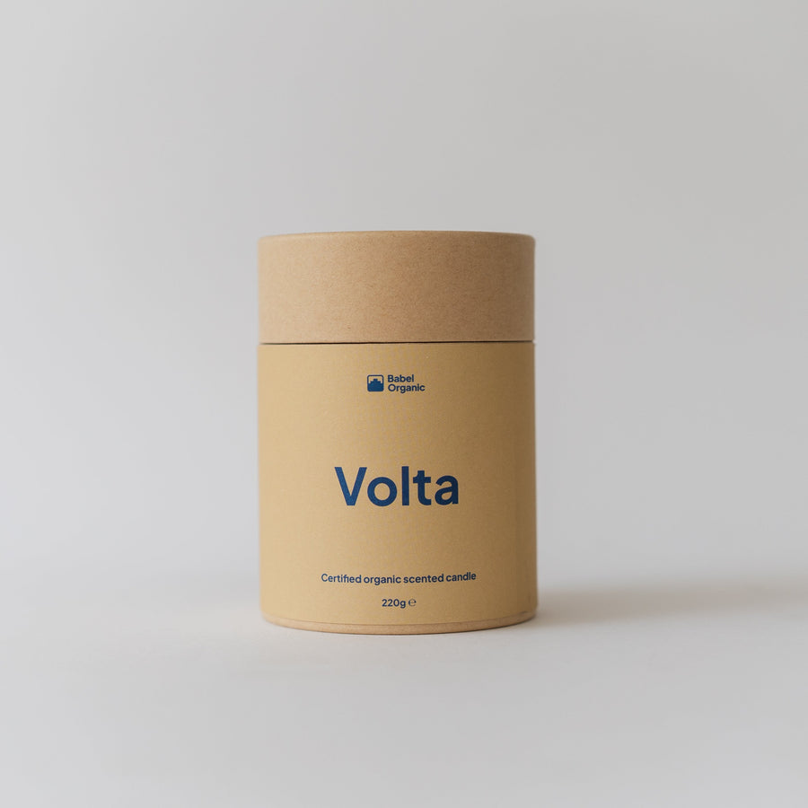 A cylindrical kraft paper container labeled 'Volta' in blue text, photographed against a clean light gray studio background.